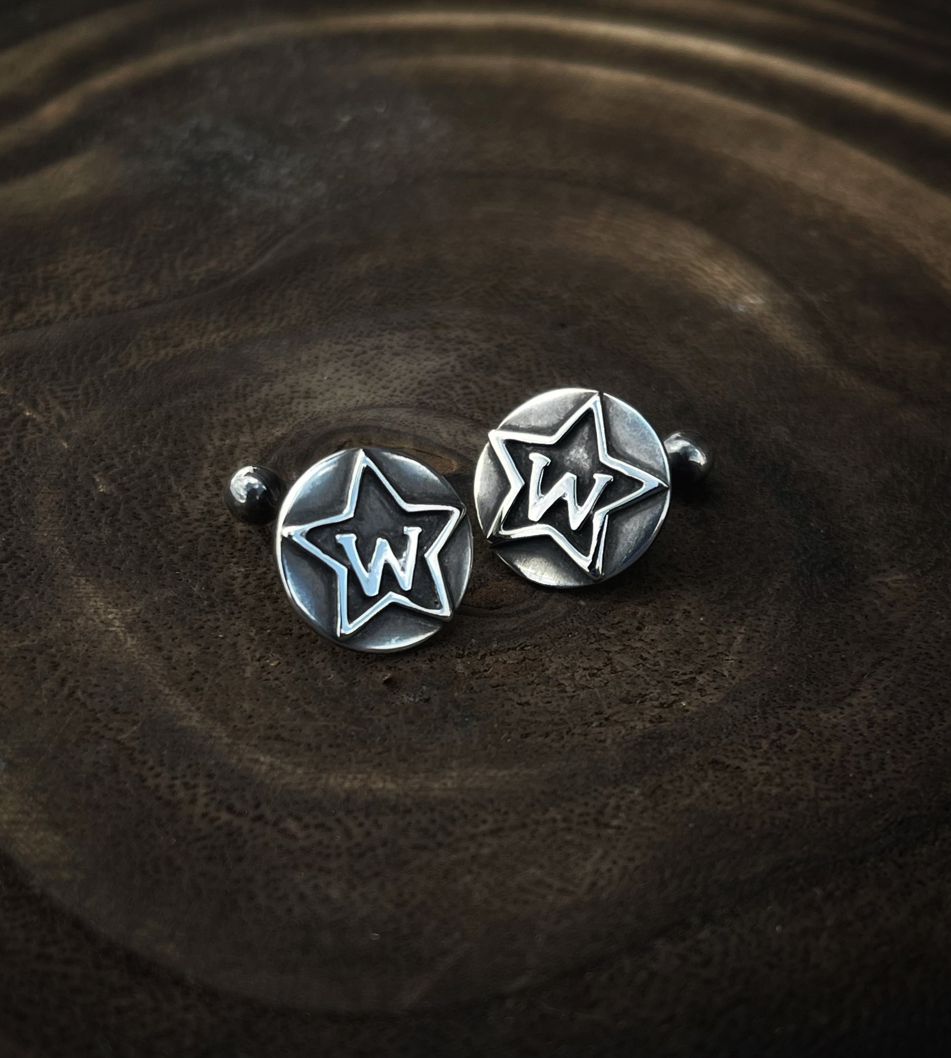 Sterling silver cufflinks with a brand overlay also in silver