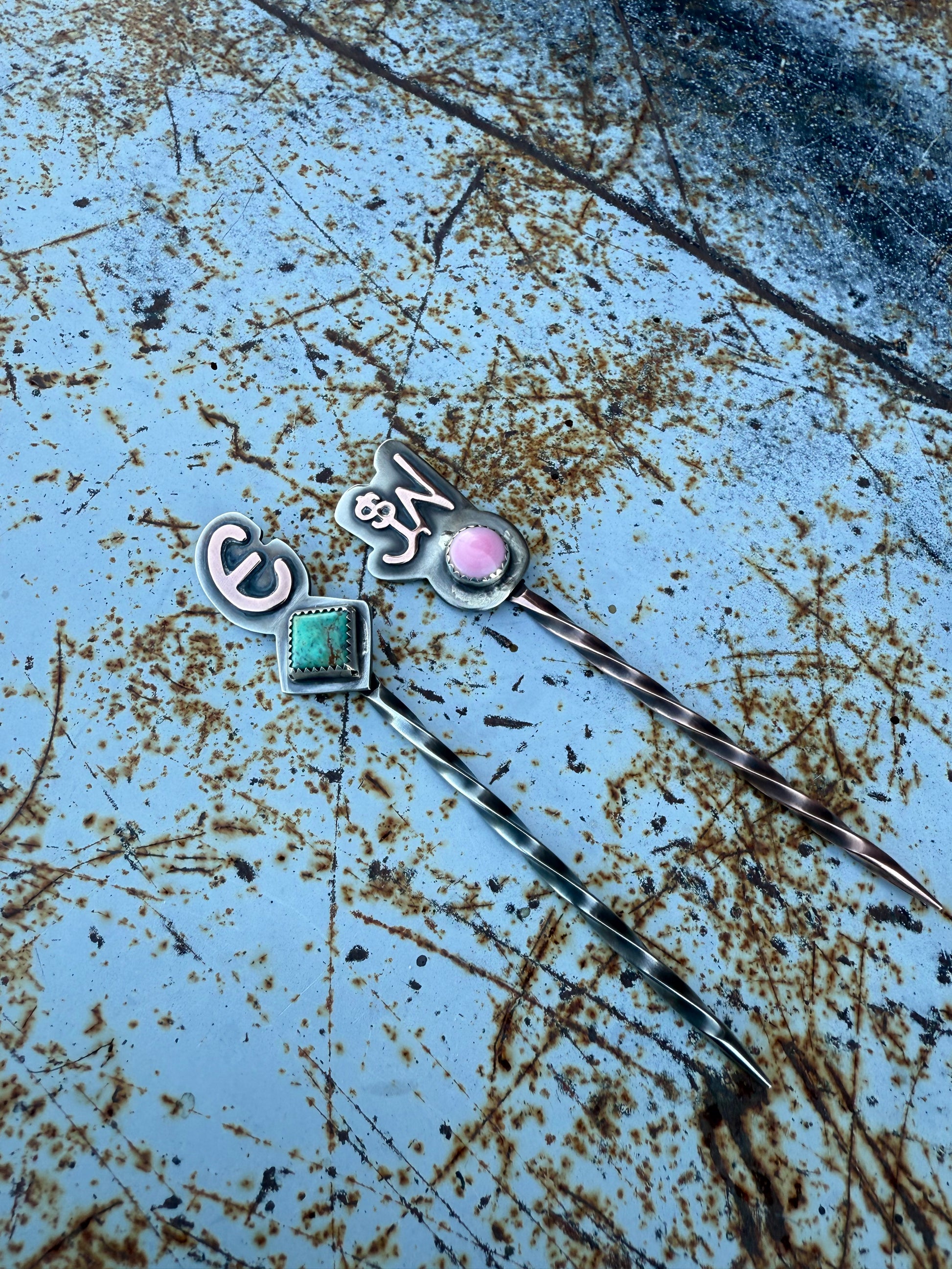 copper and silver toothpicks with turquoise and pink conch